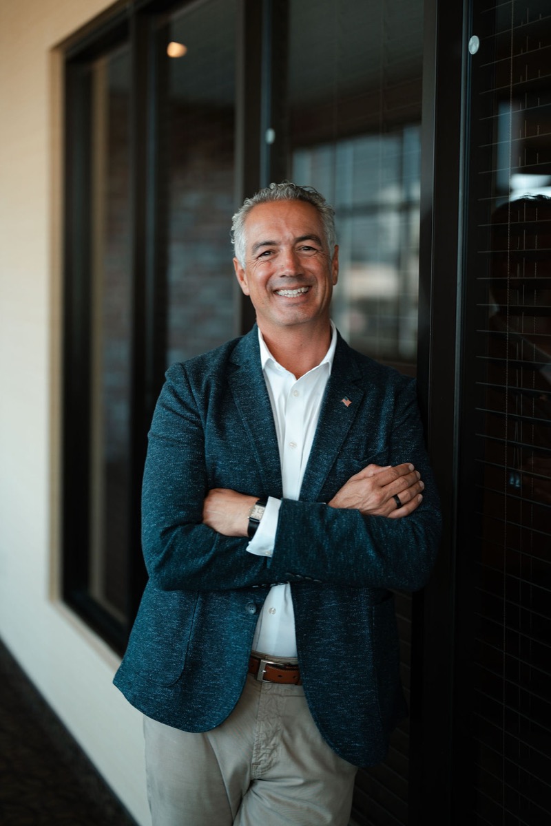 Dan Cantillana, founder of the DanCan Private Investor Network, standing outside his Spokane office